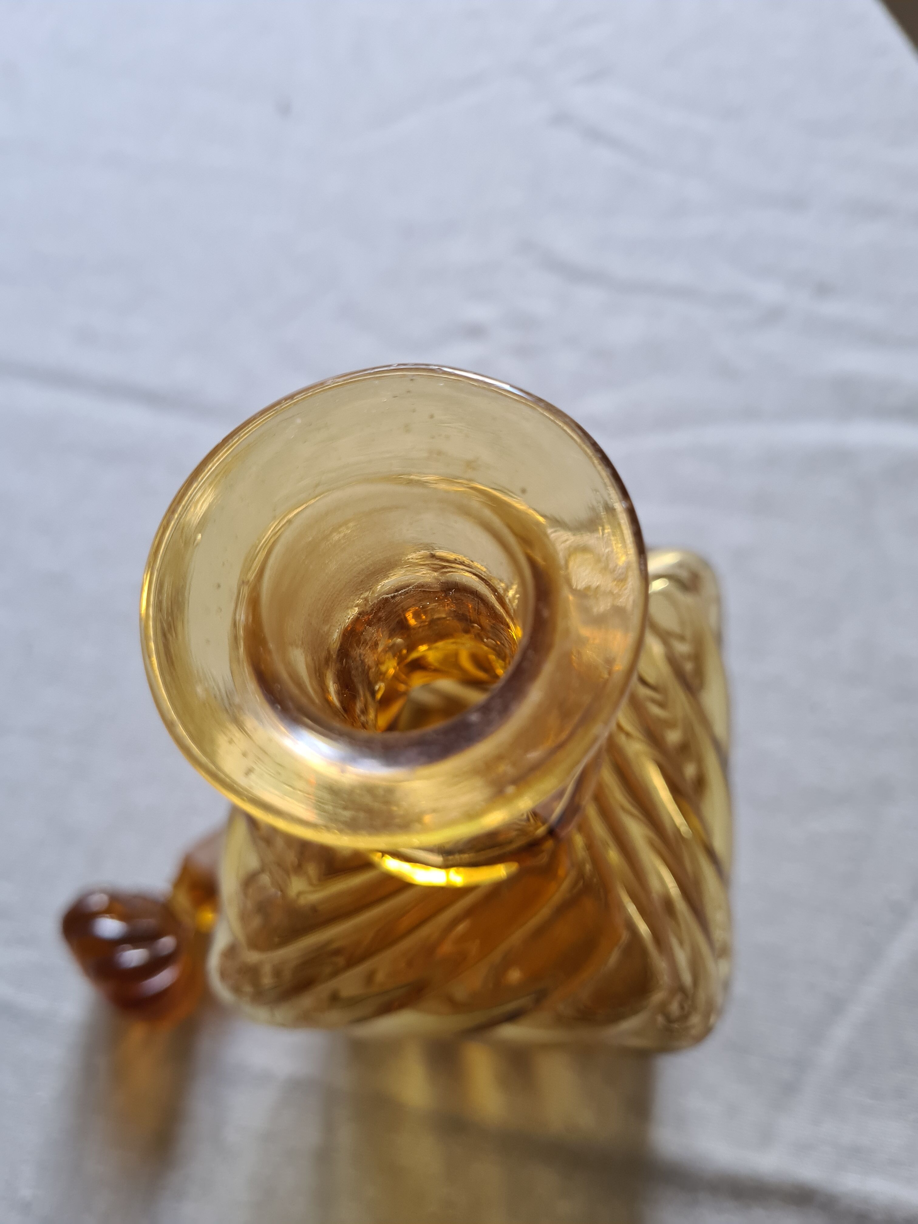 Antique decanter made of amber blown glass