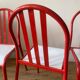 4 red metal chairs by Mallet-Stevens