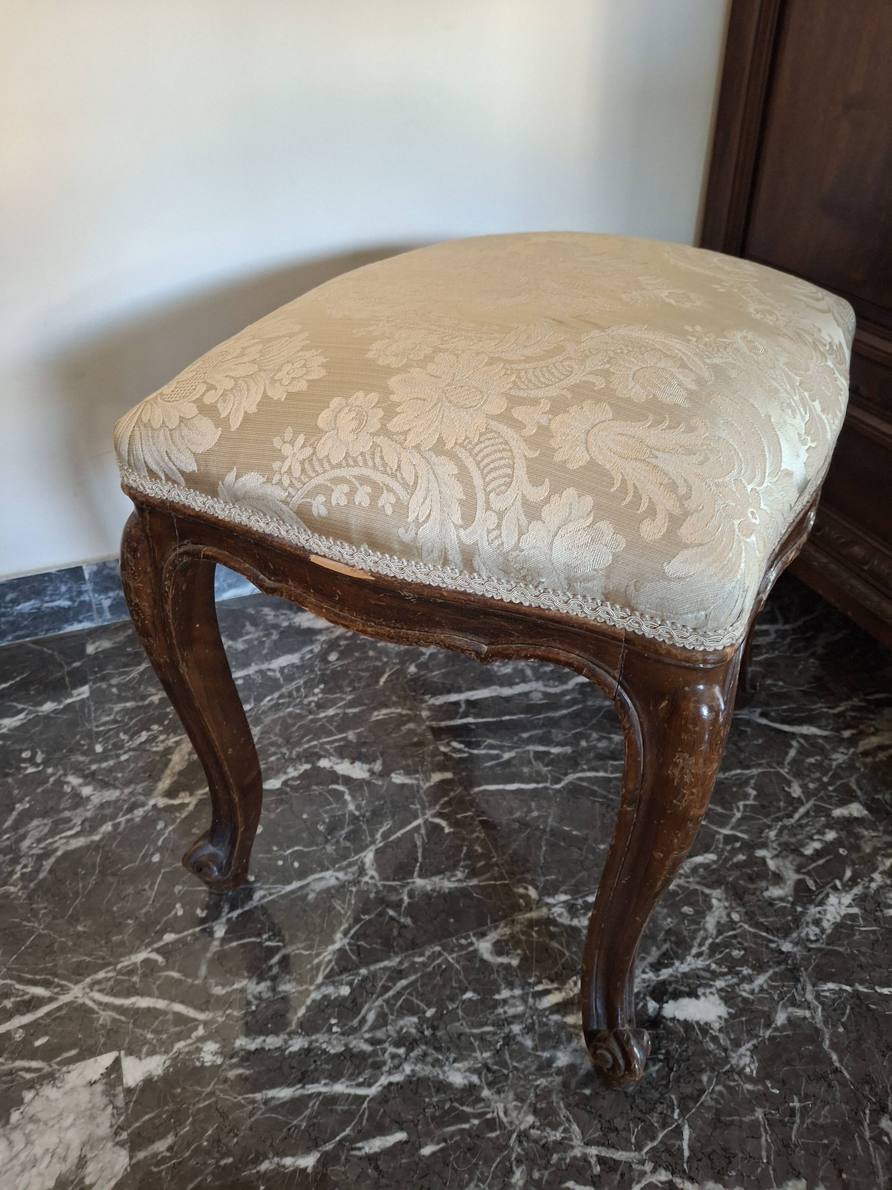 Pair of Italian armchairs from the 1960s with matching ottoman.