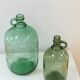 Pair of old demijohn bottles