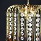 Suspension with tassels drops of water an glass
