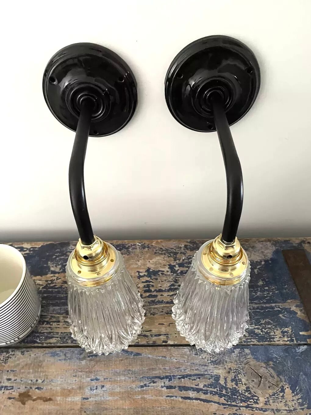 Set of two electrified chiseled glass sconces to nine