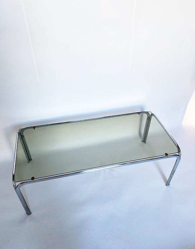 Metal table and smoked glass
