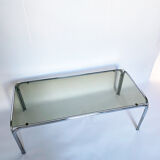 Metal table and smoked glass