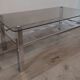 Vintage smoked glass coffee table with chrome legs.