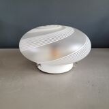 Frosted glass globe ceiling light with spiral patterns.