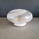 Frosted glass globe ceiling light with spiral patterns.