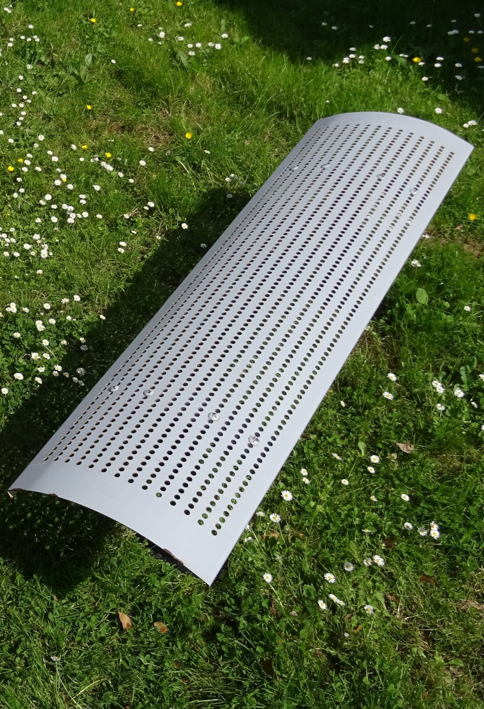 Perforated metal bench
