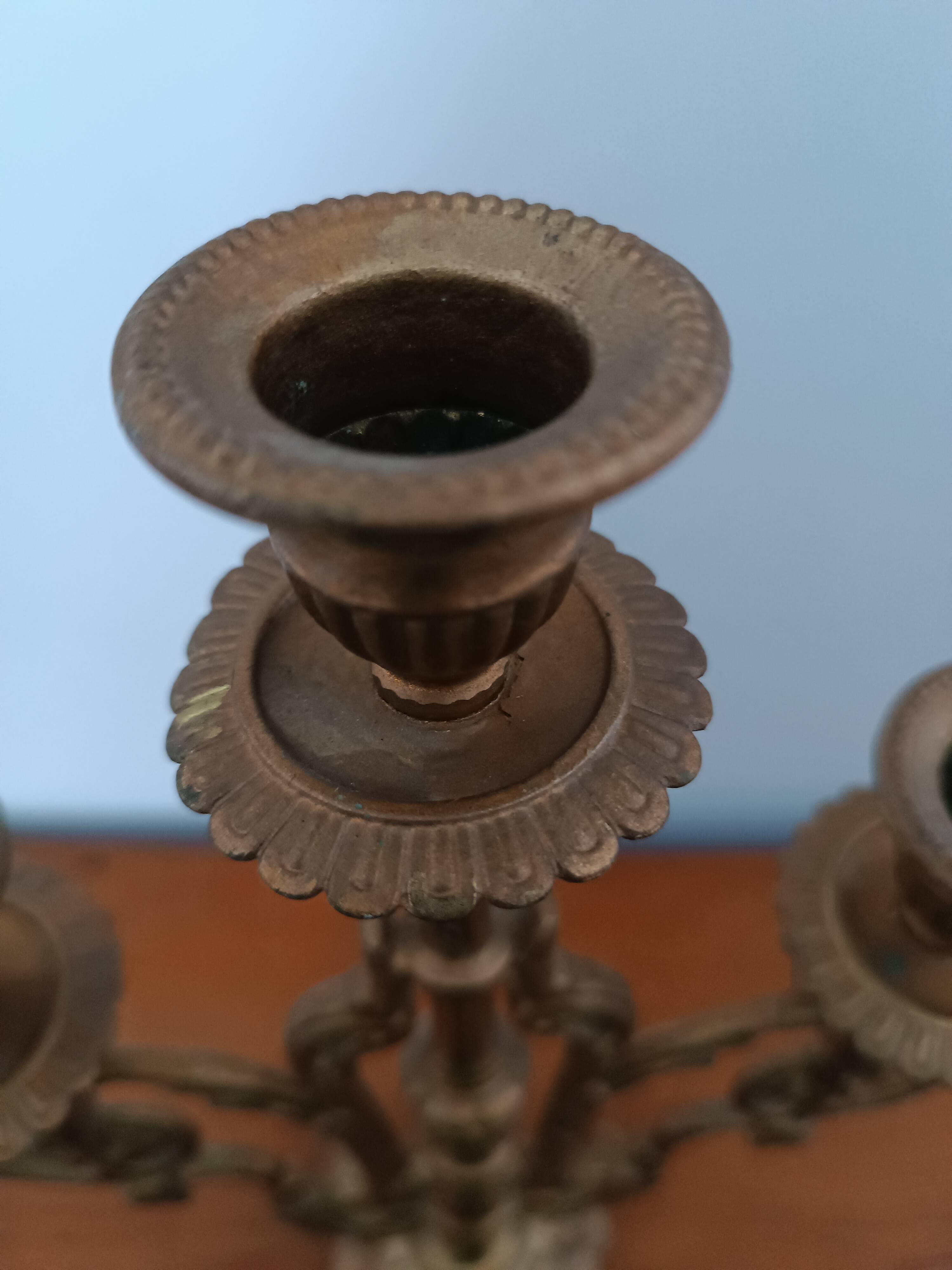 Bronze candlestick with lion head decoration