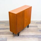 Highboard in teak wood with grooved doors,