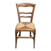 Period rustic chair with a straw seat