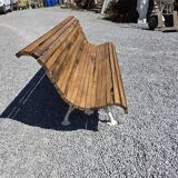Antique garden bench made of cast iron and oak slats