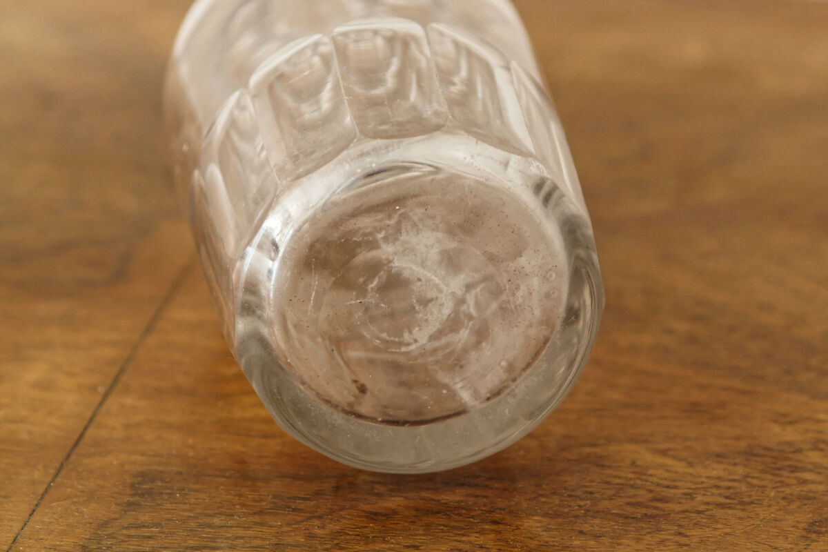Chiseled glass rum bottle
