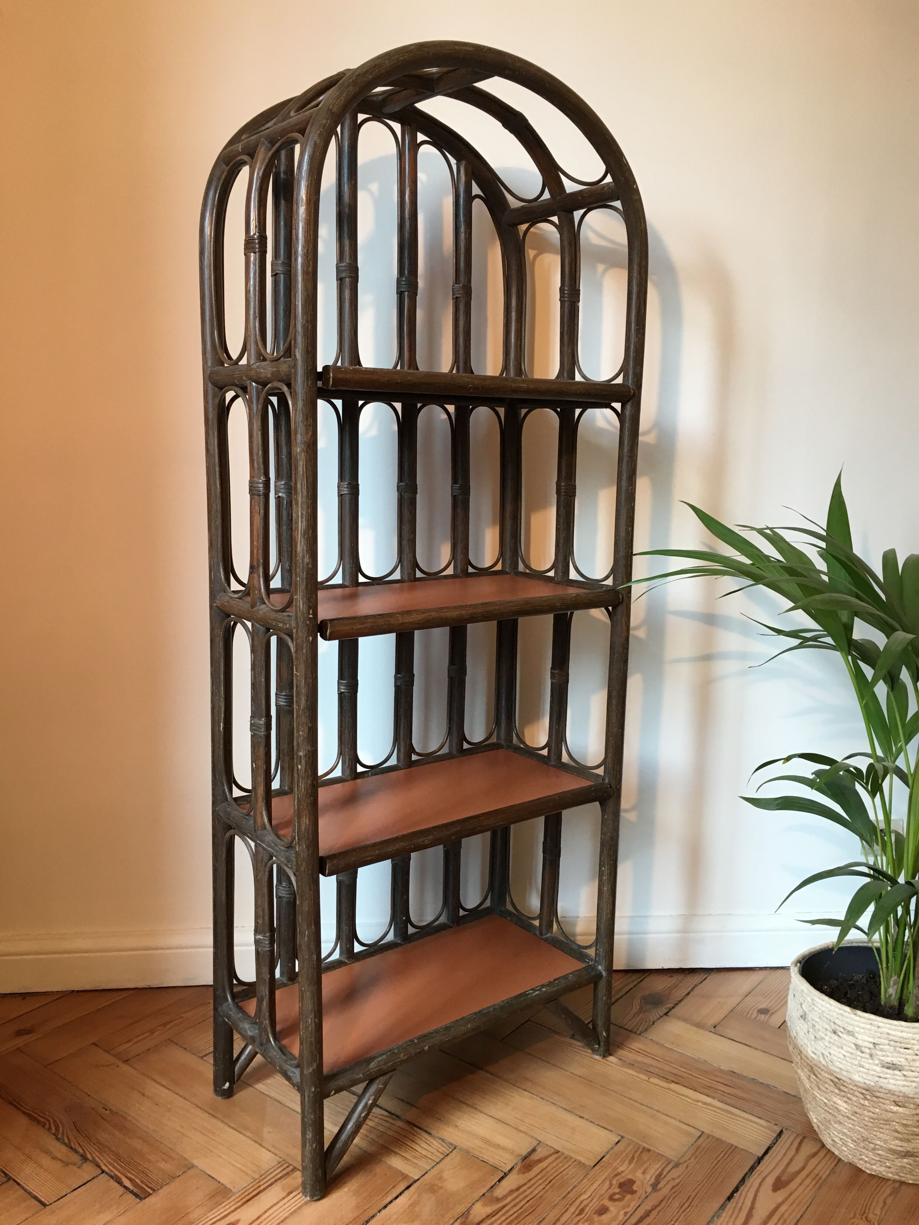 Vintage rattan library and terracotta-coloured tablets
