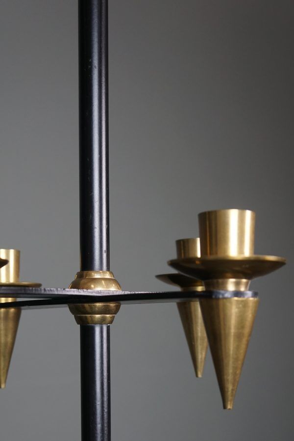 Candle holder in black metal and brass