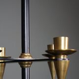 Candle holder in black metal and brass
