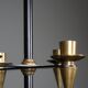 Candle holder in black metal and brass
