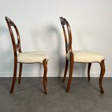Pair of Victorian English chairs known as balloon chairs in solid mahogany.