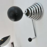 "Streamline" wall coat rack in chromed metal and black lacquered wood, 1970.