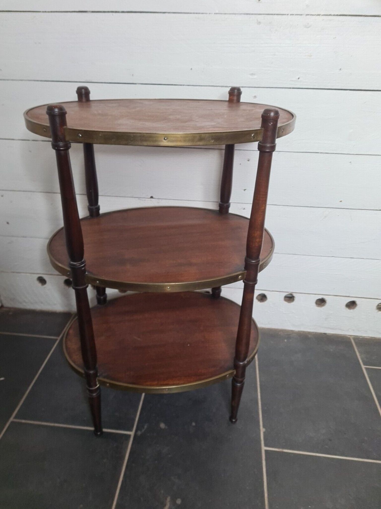 Oval mahogany side table has 3 floors
