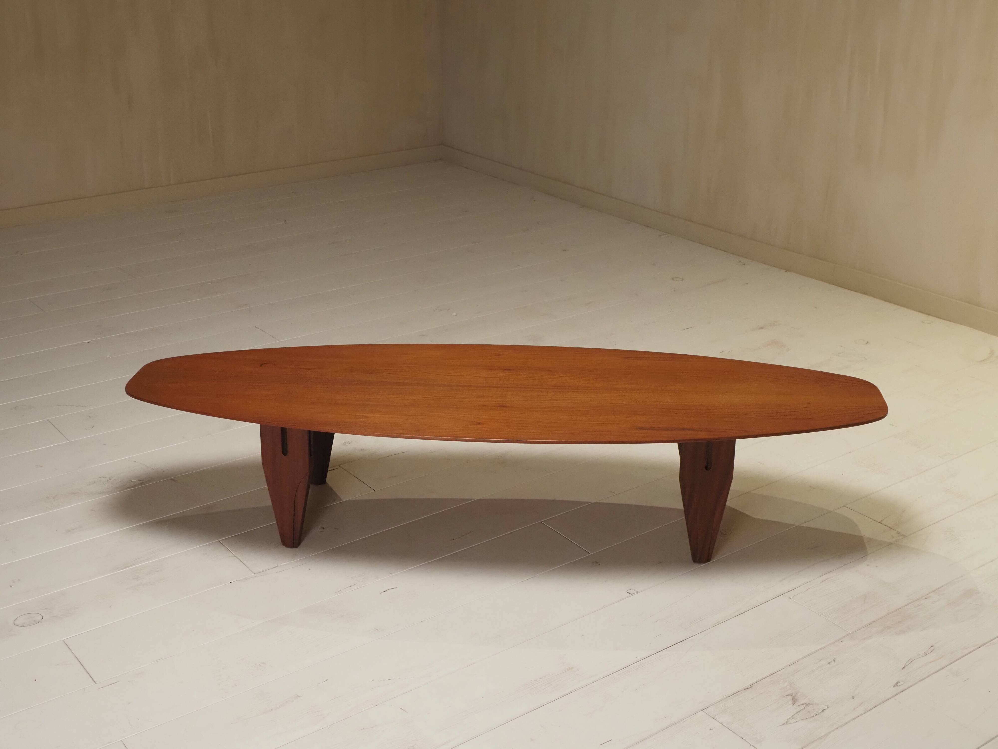 Danish coffee table in the shape of a surfboard from the 1960s.
