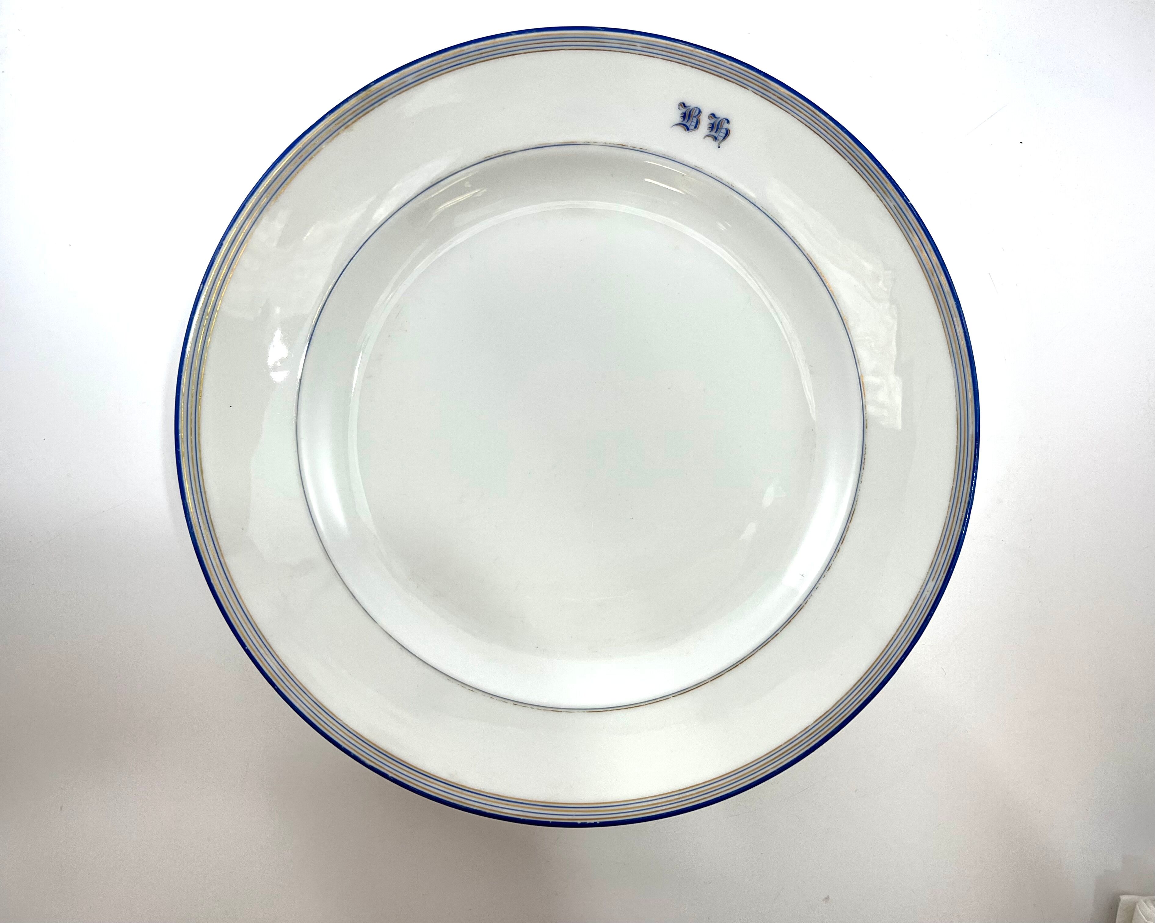 Round dish white monogrammed with blue border 34cm