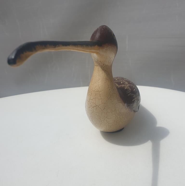 Carved painted wooden curlew