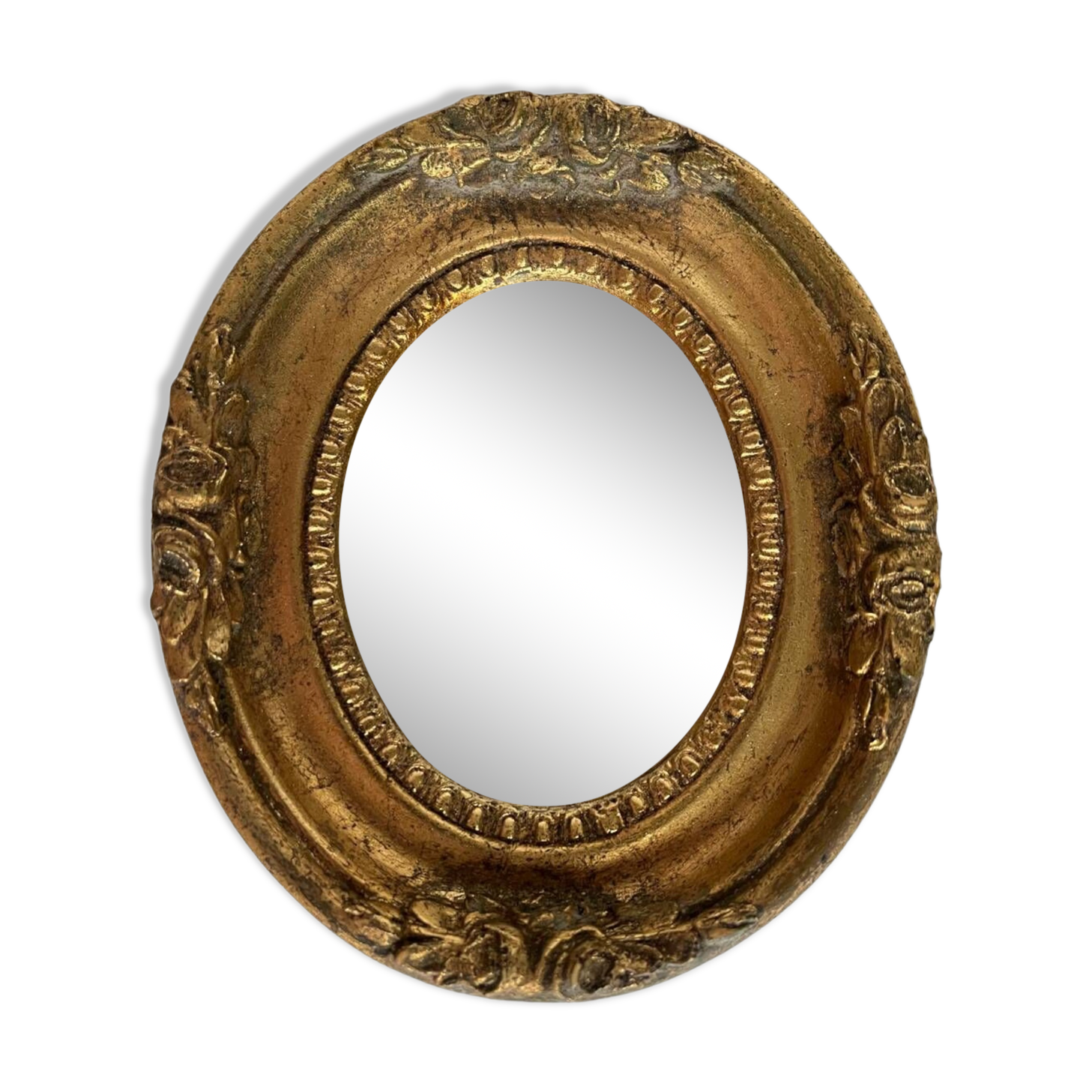 Small old mirror in gilded wood