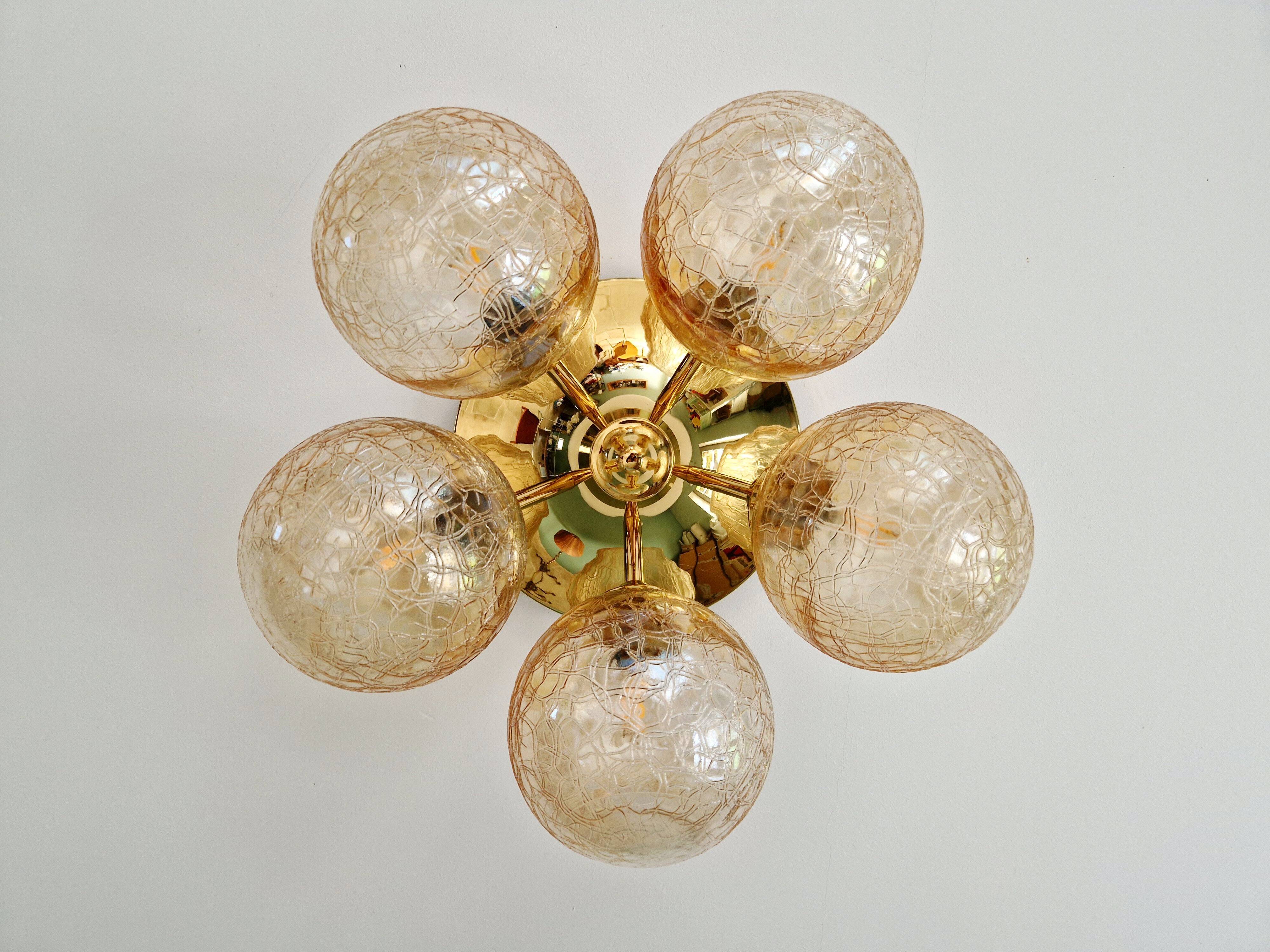 Large designer ceiling light in brass and amber crackled glass, 1970s.