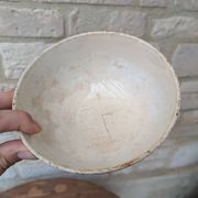 Old opaque porcelain bowl from Gien with a floral decoration.