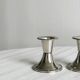 Pair of small light metal candlesticks
