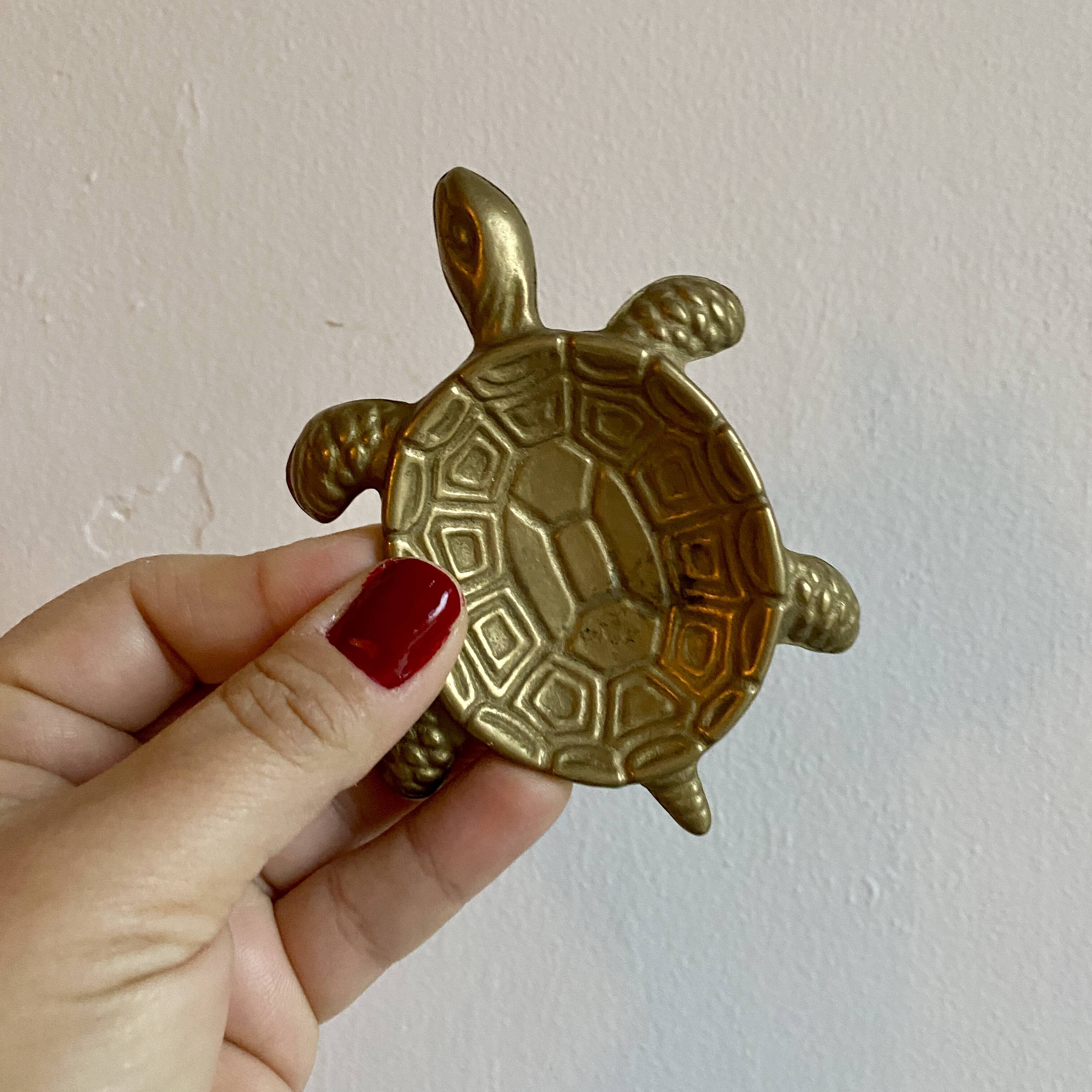 Vintage brass turtle pocket emptier