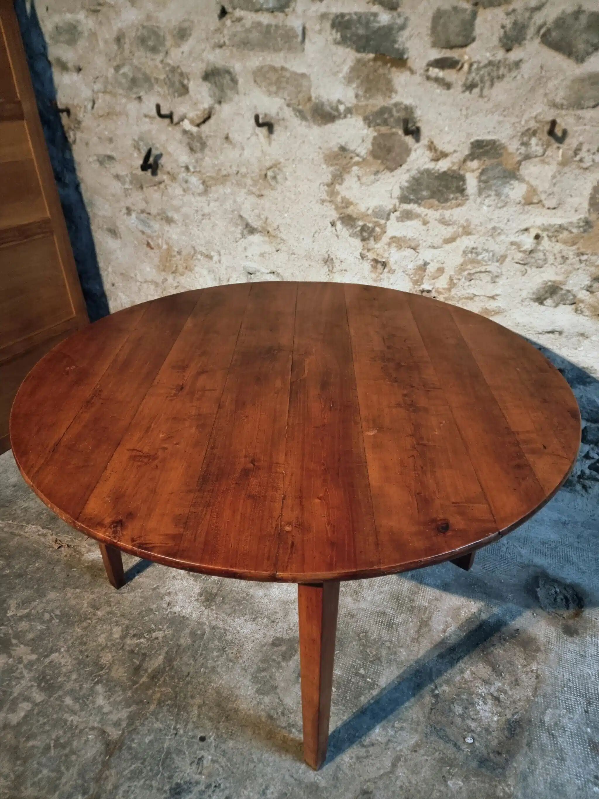 Vintage French round dining table in cherry wood, circa 1920.