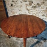 Vintage French round dining table in cherry wood, circa 1920.