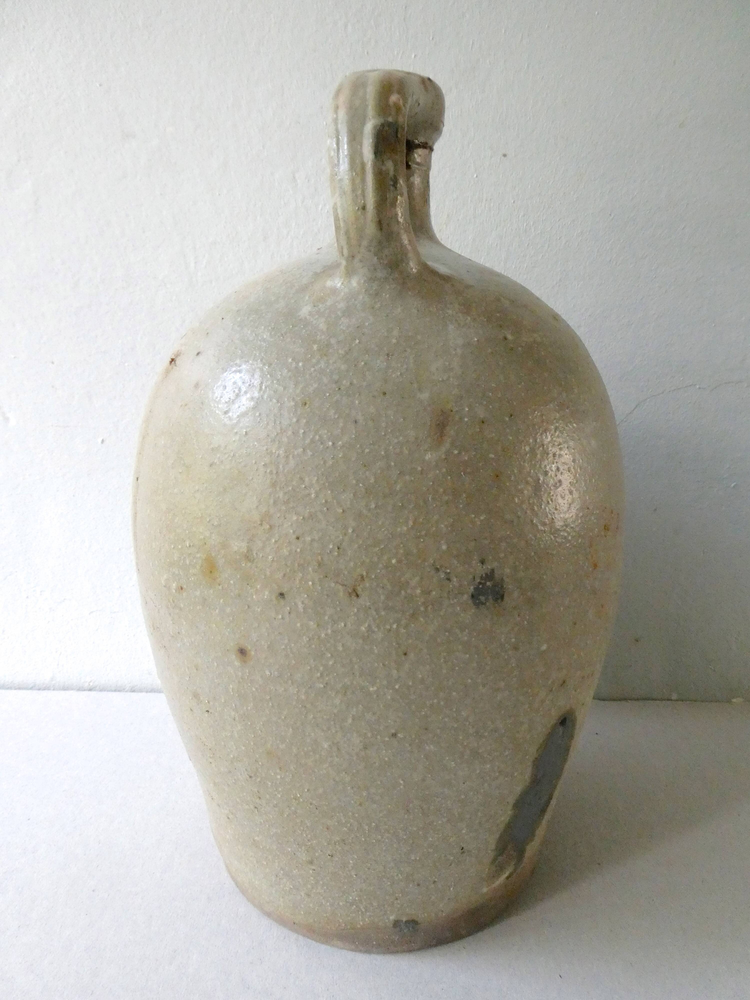 Old bonbonne in glazed stoneware