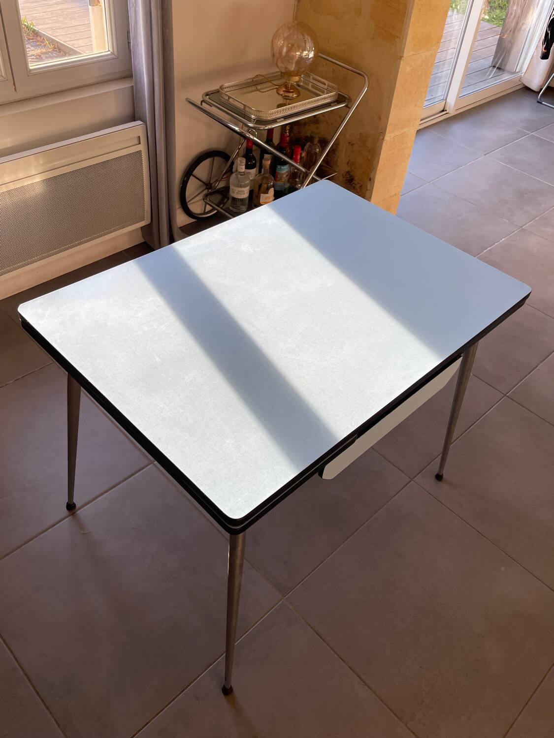 Blue Formica table for 4 to 6 people