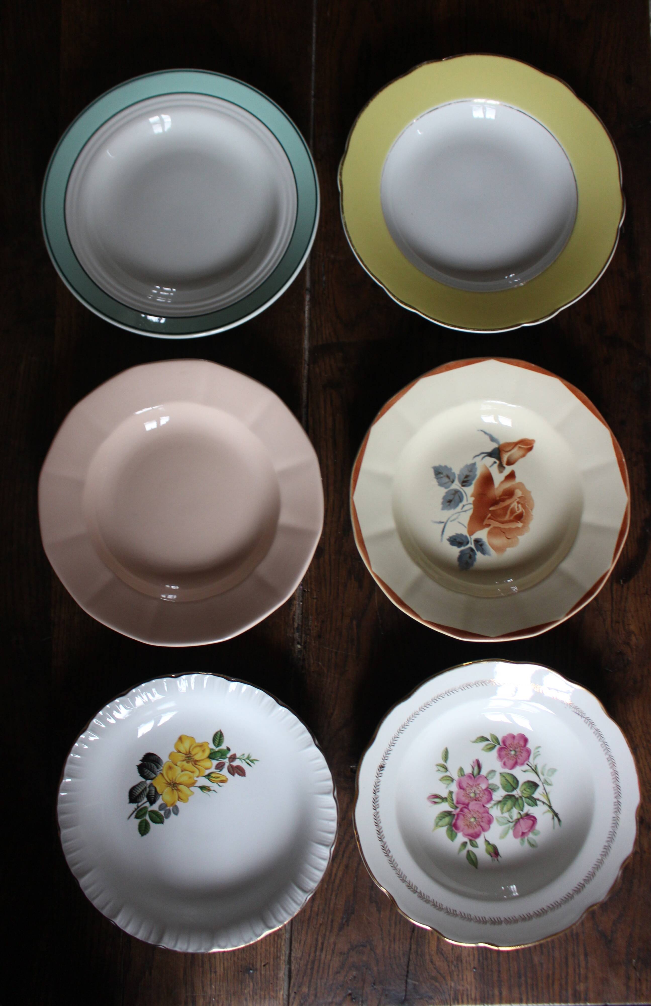 6 mismatched deep plates in floral colours from Digoin, Sarreguemines, Gien.