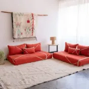 Handmade Moroccan floor cushion in orange cotton.
