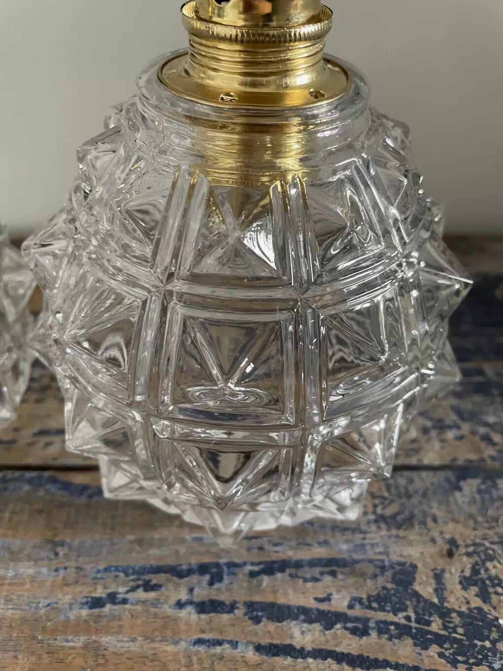 Set of two chiseled glass sconces