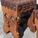 Pair of brutalist stools, leather seat.