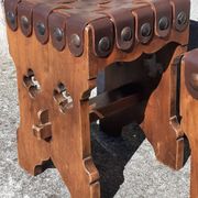 Pair of brutalist stools, leather seat.