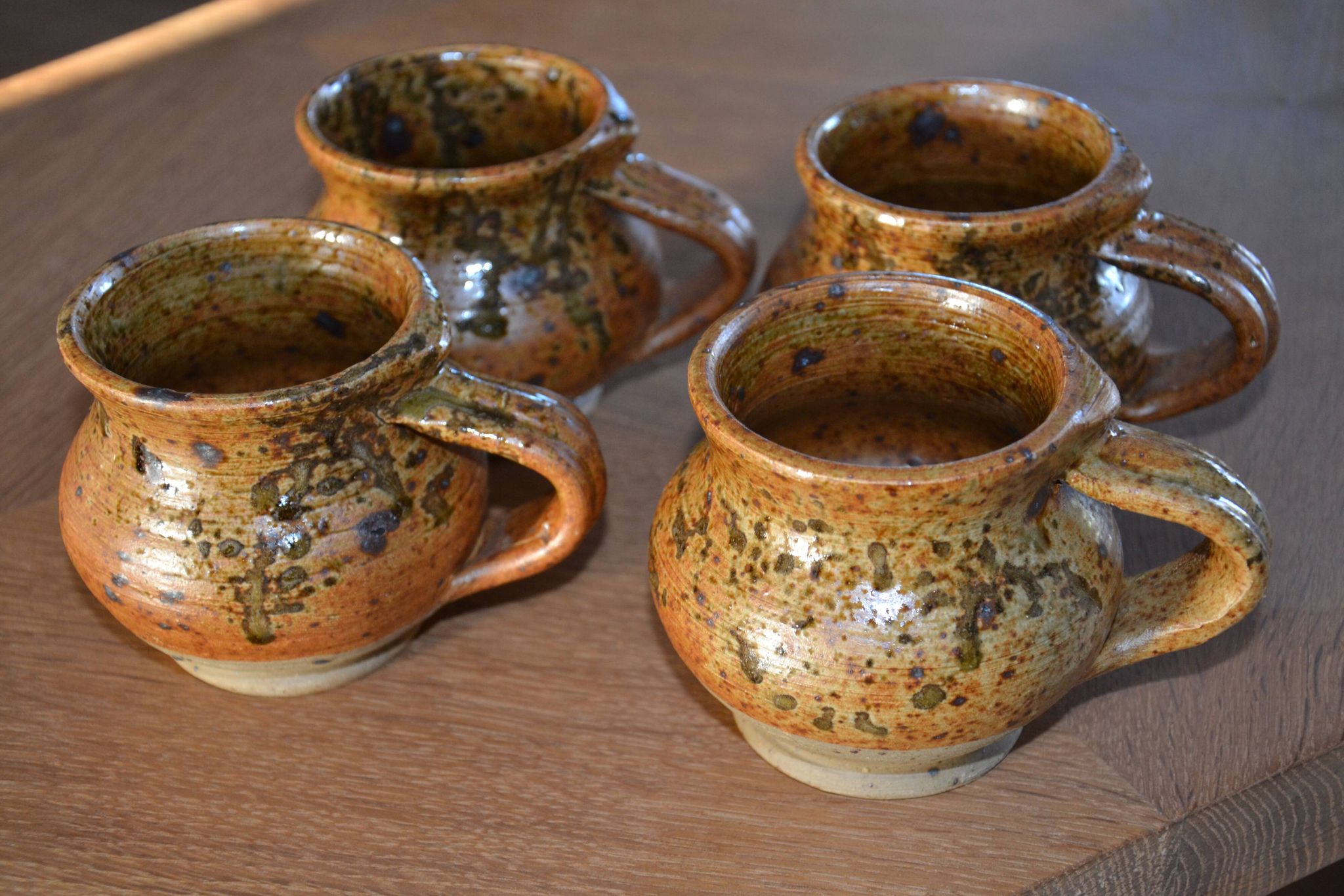 4 pyrite stoneware cups/mugs/coffee cups signed J.P.G.