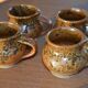 4 pyrite stoneware cups/mugs/coffee cups signed J.P.G.