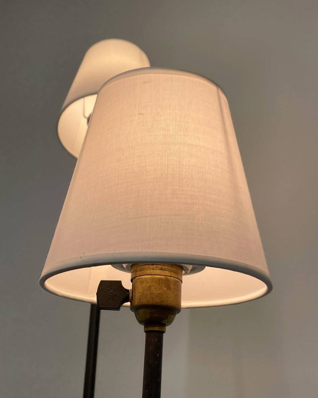 Three-light floor lamp in black lacquered metal, circa 1950.