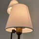 Three-light floor lamp in black lacquered metal, circa 1950.