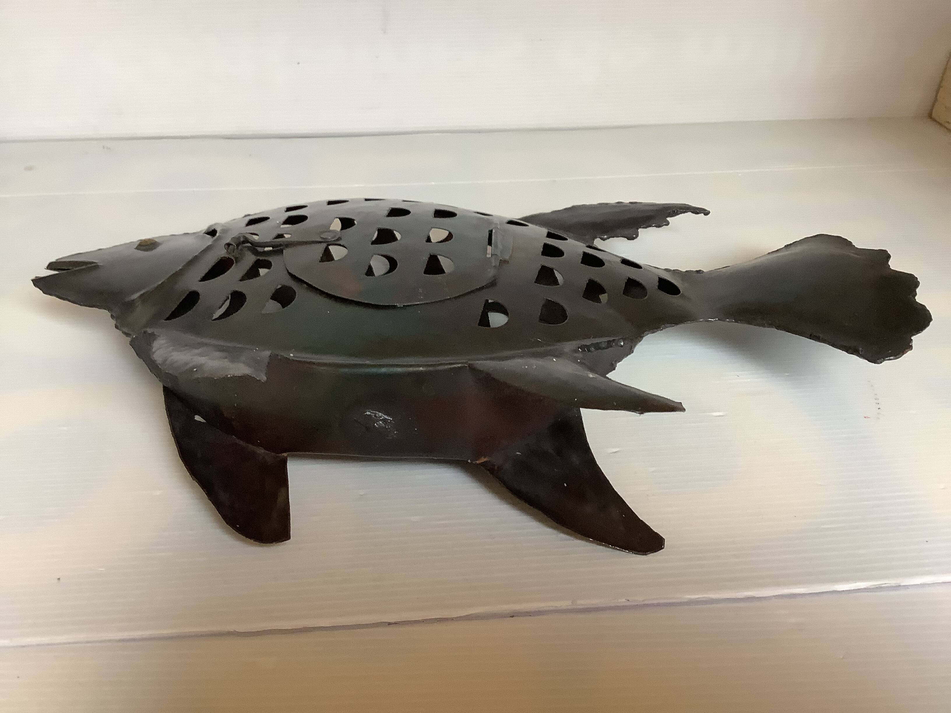 Large metal fish-shaped candle holder