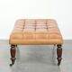 Sheepskin ottoman/coffee table on wheels in English chesterfield style