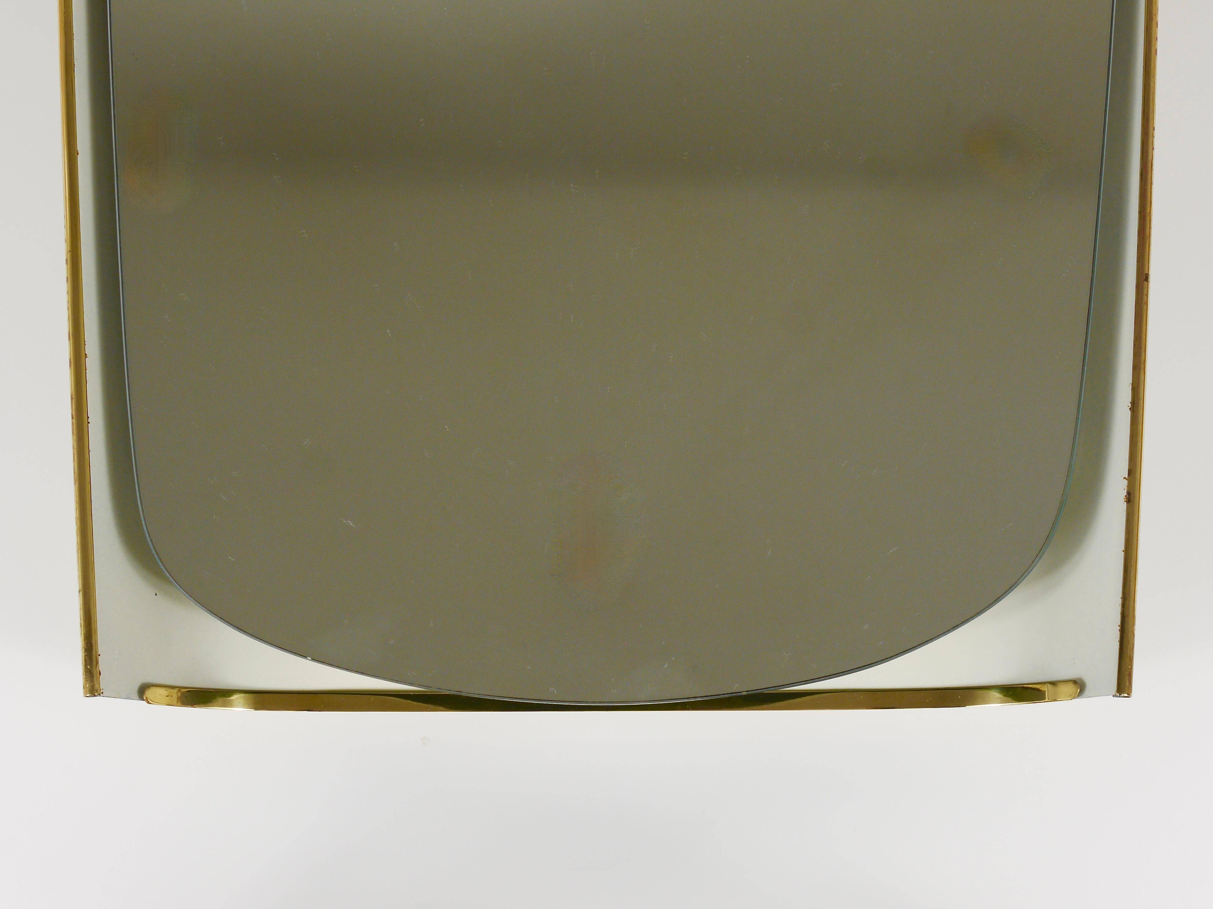 Mid-century illuminated wall mirror by Ernest Igl with brass crown, by Hillebrand.