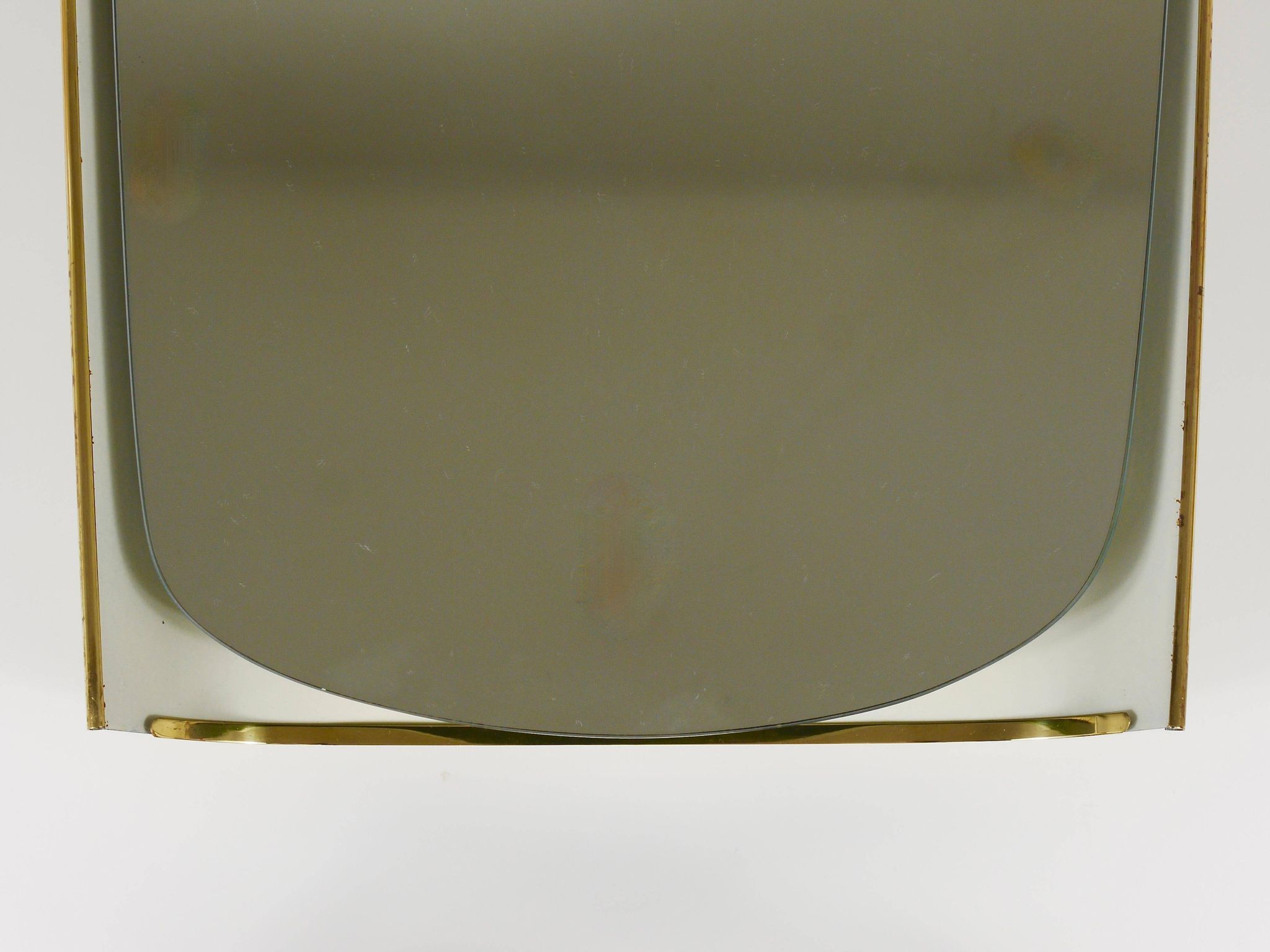 Mid-century illuminated wall mirror by Ernest Igl with brass crown, by Hillebrand.