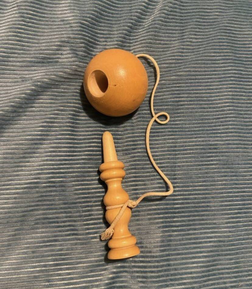 Vintage wooden cup-and-ball game